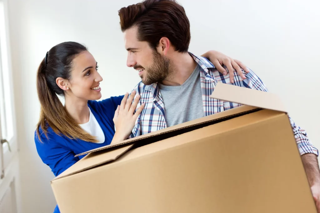 young couple moving new home scaled